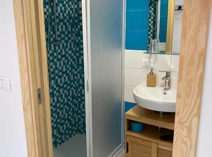 Гостевой дом Laguna Blu Sole Con Terrazza Panoramica In Comune