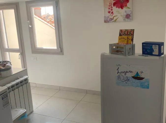 Гостевой дом Laguna Blu Sole Con Terrazza Panoramica In Comune